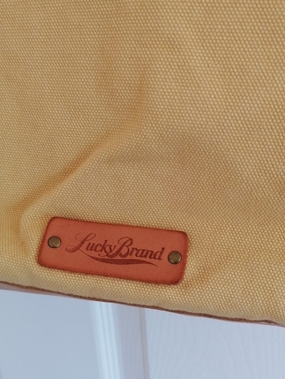 Yellow Lucky Brand canvas bag with leather Logo Patch.Great for every day!